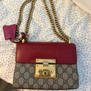 Gucci Bag red padlock with GG supreme monogram throughout.